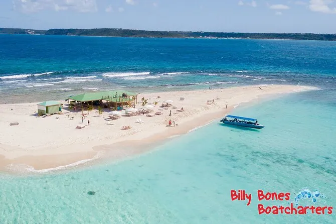Travelers swimming over a coral reef on a St Maarten snorkeling eco excursion to Creole Rock and Tintamarre in St Maarten