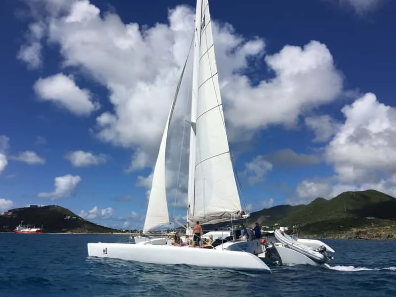 Trimaran sailing the coast on a St Maarten snorkeling and sailing cruise from Simpson Bay in St Maarten