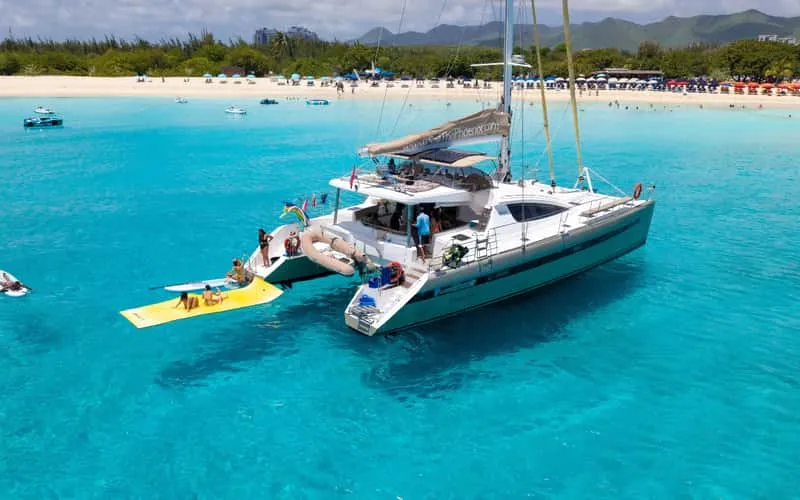 Luxury catamaran over clear water on a St Maarten snorkeling day sail near Maho Beach in St Maarten